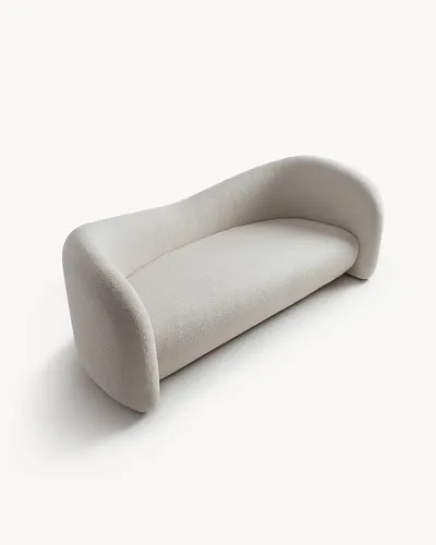 Canapé VELA, vue angulaire qui met en évidence la silhouette fluide et sculpturale