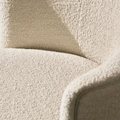 Fauteuil MUSE, détail du revêtement en tissu bouclé