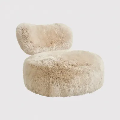 Fauteuil NOOR, vue latérale de la silhouette sculpturale