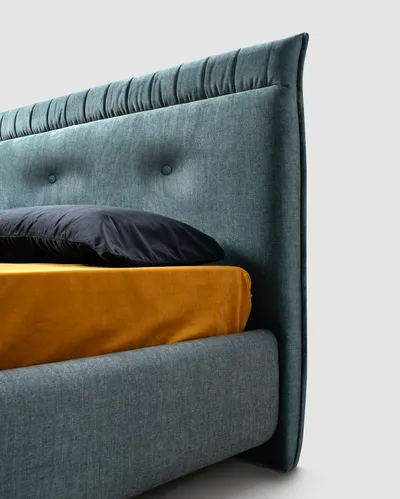 Side detail of the SOREN bed's upholstered headboard