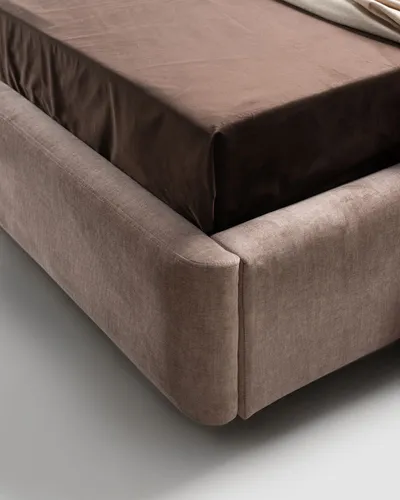 Detail of ASTON bed's rounded upholstered base