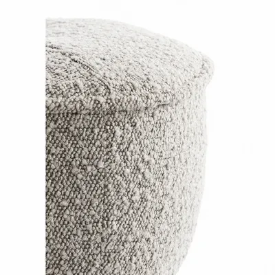 Detail of the stitching and bouclé fabric of the MILO pouf