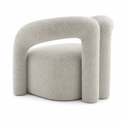 Fauteuil KODAK, vue angulaire soulignant le cadre incurvé et sculptural