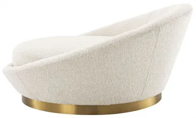 Fauteuil AURA, profil latéral révélant les lignes enveloppantes et le revêtement bouclé