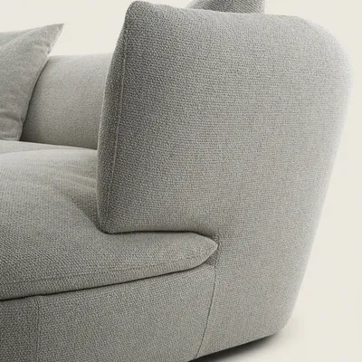 Détail du dossier sculptural SELINE avec coussin d'appoint en tissu Memphis