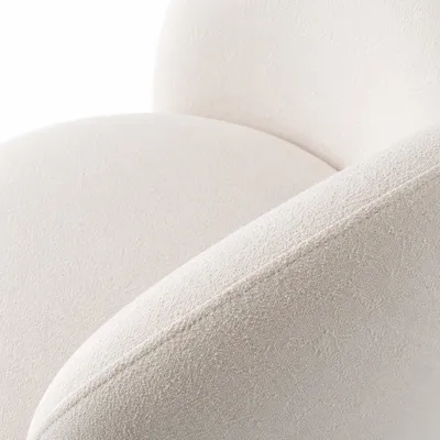 Détail du revêtement bouclé du fauteuil MANON