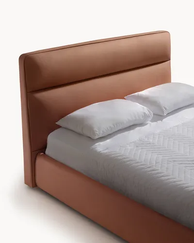 Détail de la tête de lit rembourrée du lit VEXON
