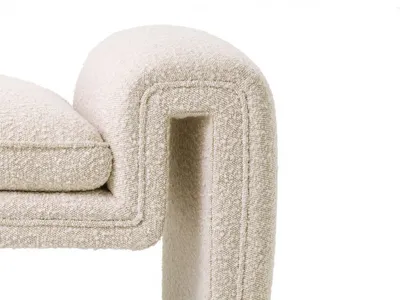 Close-up detail of MONO bench's sculptural arch and bouclé upholstery