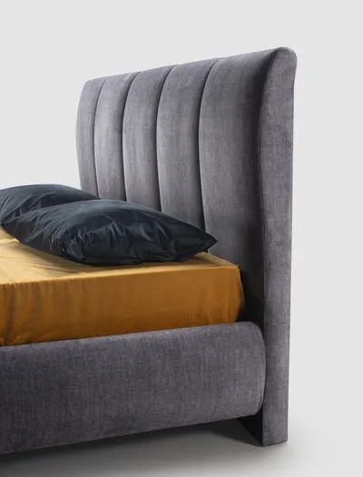 Detail of the VALEN bed's upholstered headboard