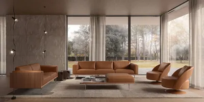 Sofa RYDEN in einem zeitgenössischen Wohnzimmer mit texturierter Wand und großen Fensterfronten